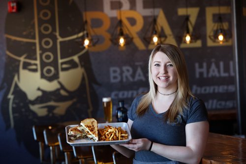 WAYNE GLOWACKI / WINNIPEG FREE PRESS

Aedin Kristjanson,  a serve at the Brazen Hall on Pembina Hwy. with a Porchetta Cubano and House Fries. Ben MacPhee-Sigurdson story    April 6     2017