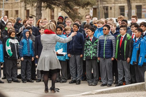 MIKE DEAL / WINNIPEG FREE PRESS
The Winnipeg Boys' Choir sings during the memorial celebration of the 100th Anniversary of the Battle of Vimy Ridge at the memorial cenotaph on Memorial Boulevard on Sunday afternoon.
170409 - Sunday, April 09, 2017.