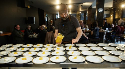 MIKE DEAL / WINNIPEG FREE PRESS
Chef Ben Kramer prepares the dessert dish during the Sunday Brunch Collective at the Kitchen Sync on Donald Street Sunday afternoon.
170409 - Sunday, April 09, 2017.