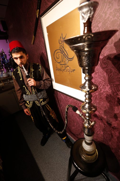 JOHN WOODS / WINNIPEG FREE PRESS
Mohammed Huri smokes a hookah at Arabesque Hookah Cafe and Restaurant in Winnipeg Sunday, April 9, 2017.