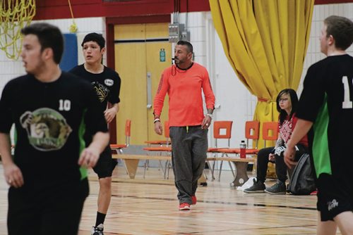 Canstar Community News Iggy Grinevsky (middle, in orange shirt) has been running basketball camps in northern communities for several years.
