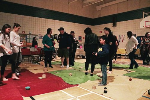 Canstar Community News People held objects that represent their role in Indigenous society during the blanket exercise at Walk a Mile in our Moccasins: Truth and Reconciliation Training at Collicutt School on April 4, 2017.