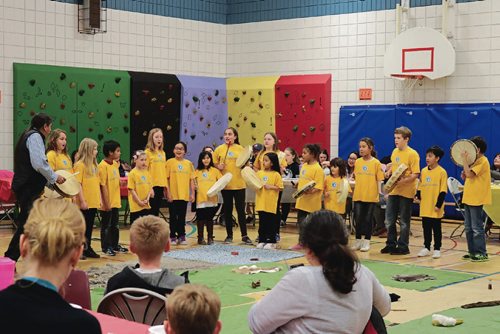 Canstar Community News Children sing at Walk a Mile in our Moccasins: Truth and Reconciliation Training at Collicutt School on April 4, 2017.