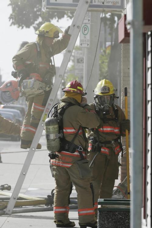 John Woods / Winnipeg Free Press / August 9, 2008 - 080809  - Winnipeg firefighters tackle a fire at 593 - 597 Notre Dame this afternoon Saturday, August 9, 2008.