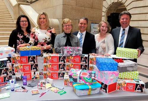 BORIS MINKEVICH / WINNIPEG FREE PRESS
Workplace Shoebox Challenge event at the Grand Staircase/Manitoba Legislative Building. From left, Shoppers Drug Mart owner Marilyn Sidhu, Minister of Sport, Culture, & Heritage Rochelle Squires, Shoebox Project founder Eva Whitmore, Finance Minister Cameron Friesen, Manitoba Shoebox coordinator Alex Todd, and Manitoba Realestate Association's Chris Pennycook. The group poses in front of all the shoeboxes the government members put together. April 11, 2017