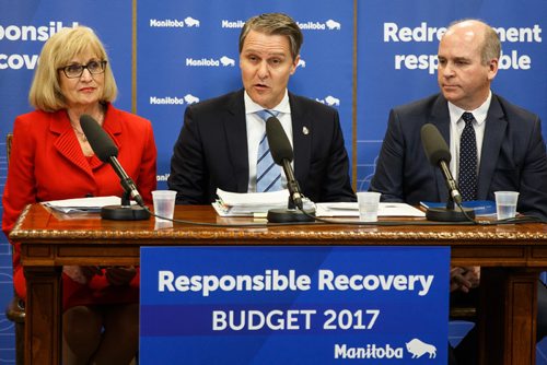 MIKE DEAL / WINNIPEG FREE PRESS
Government of Manitoba Finance Minister Cameron Friesen, flanked by Janice McKinnon (left) and Dave Angus (right) who are co-chairs of the advisory panel on fiscal performance, during his presentation of the 2017-2018 budget to the media.
170411 - Tuesday, April 11, 2017.