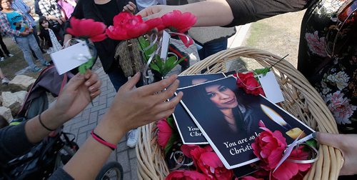 PHIL HOSSACK / WINNIPEG FREE PRESS  - Flowers are passed out at a vigil held at Thunderbird House Wednesda for Christine Wood. ....See Carol's story.  -  April 12, 2017