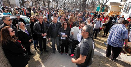 PHIL HOSSACK / WINNIPEG FREE PRESS  - George and Melinda Wood are surrounded by hundreds of supporters near the scene of her murder on Burrows ave during a vigil and march to Thunderbird House Wednesday. ....See Carol's story.  -  April 12, 2017