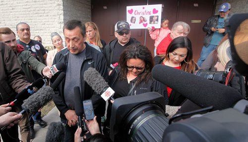 PHIL HOSSACK / WINNIPEG FREE PRESS  - George and Melinda Wood , parents of murder victim Christine Wood talks to a media scrum before beginning a march from near the scene of her murder on Burrows ave to Thunderbird House Wednesday. ....See Carol's story.  -  April 12, 2017
