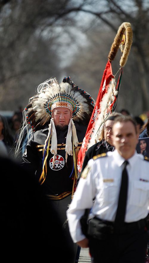PHIL HOSSACK / WINNIPEG FREE PRESS  - Grand Chief Darren Nepinak dressing in his regailia marches with supporters of the Wood family near the scene of Christine Wood's murder on Burrows ave during a vigil and march to Thunderbird House Wednesday. ....See Carol's story.  -  April 12, 2017