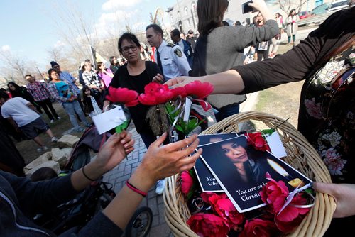 PHIL HOSSACK / WINNIPEG FREE PRESS  - Flowers are passed out at a vigil held at Thunderbird House Wednesda for Christine Wood. ....See Carol's story.  -  April 12, 2017