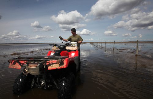 RUTH BONNEVILLE /  WINNIPEG FREE PRESS

Matt Van Steelandt a rancher in the Lauder area of southwestern Manitoba uses his quad to get through the high flood water on his land to get to his bulls that are surrounded in water.  
See Randy Turner  Flooding story.


April 12, 2017