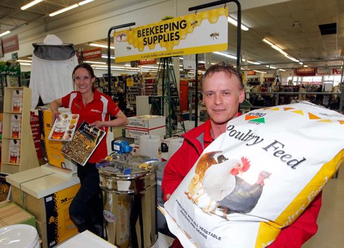 BORIS MINKEVICH / WINNIPEG FREE PRESS
From left, Peavey Mart Assistant Manager Renea Watson and store manager Sam Spiropoulos pose with some honey-bee-related equipment/supplies and some chick feed. The company just announced it will be opening a second Winnipeg outlet this fall on south Pembina Highway. Murray McNeill story. April 13, 2017