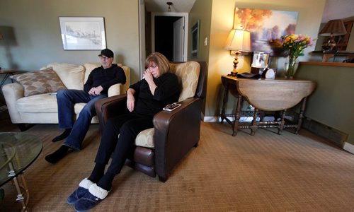 PHIL HOSSACK / WINNIPEG FREE PRESS  - Scott Oake Scott and Anne Oake reflect in their son Bruce, lost to addiction. they and second son Darcy hope to turn this death into something positive for other addicts. Bruce's urn and portrait sit under they lamp on the table behind Anne. See Randy Turner's story. -  April 13, 2017