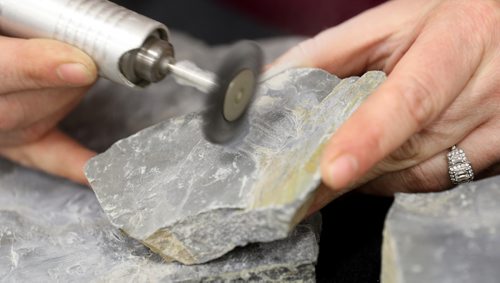 TREVOR HAGAN / WINNIPEG FREE PRESS
Melissa Robak excavates a 550 million year old trilobite fossil from shale. Trilobites are a group of extinct marine animals. The Silver Cove gem and rock show at the Red River Exhibition Grounds, Saturday, April 15, 2017. The show wraps up Sunday.
