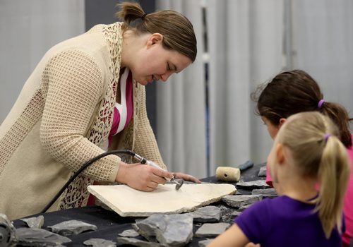 TREVOR HAGAN / WINNIPEG FREE PRESS
Melissa Robak excavates a 550 million year old trilobite fossil from limestone. Trilobites are a group of extinct marine animals. The Silver Cove gem and rock show at the Red River Exhibition Grounds, Saturday, April 15, 2017. The show wraps up Sunday.
