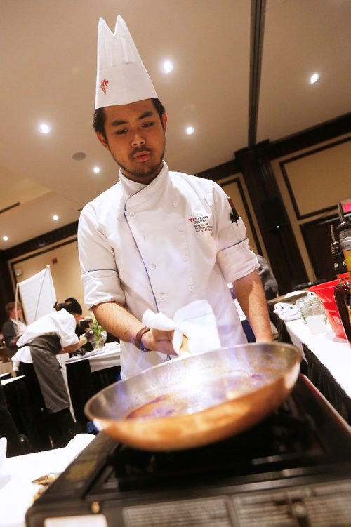 JOHN WOODS / WINNIPEG FREE PRESS
Patrick Tan, 2nd year student at Red River College, prepares Bananas Foster Flambe at the Taste Of The Nation for No Kid Hungry 2017 fundraising event at the Fairmont Monday, April 17, 2017.