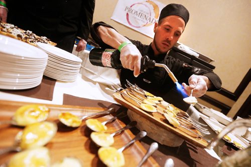 JOHN WOODS / WINNIPEG FREE PRESS
Keith Mercier, cook at Promenade Cafe, prepares some Creme Brulleeat the Taste Of The Nation for No Kid Hungry 2017 fundraising event at the Fairmont Monday, April 17, 2017.