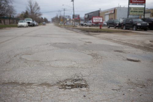 JEN DOERKSEN/WINNIPEG FREE PRESS
Chevrier Boulevard made first for worst street in Winnipeg. Carlos Bergantim said it was recently patched, but he doesnt expect it to hold for too long. Tuesday, April 18, 2017.
