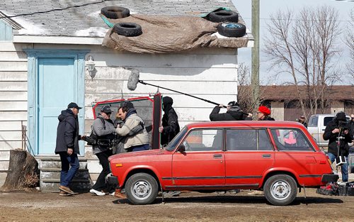 PHIL HOSSACK / WINNIPEG FREE PRESS  - Crew members walk through a scene on the outdoor set in Marquette Manitoba Tuesday. See Alex Paul story.  -  April 18,  2017
