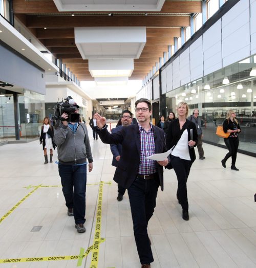 WAYNE GLOWACKI / WINNIPEG FREE PRESS

In centre, John Scott. Senior Vice President, Development at Ivanhoe Cambridge leads the media tour through the Outlet Collection Winnipeg, the new factory outlet mall under construction at Sterling Lyon Parkway and Kenaston Blvd. Thursday. The $200-million, 400,000square-foot outlet location is scheduled to open on May 3.¤  Murray McNeill story  April 20 2017