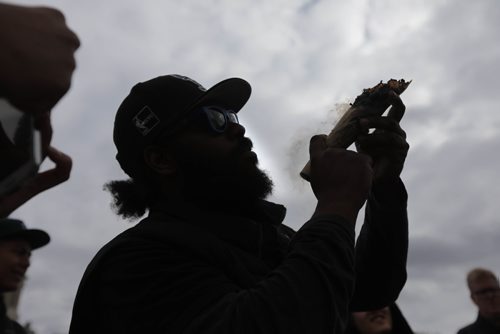 RUTH BONNEVILLE /  WINNIPEG FREE PRESS

People gather at the Manitoba Legislative grounds to celebrate 4/20 and smoke pot (cannabis, marihuana) Thursday. 
Anthony Cohen smokes huge dube at Leg with friends.    

 
April 20, 2017