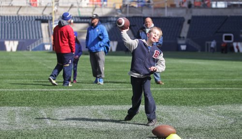 MIKE DEAL / WINNIPEG FREE PRESS

James Estabrooks, 10, along with about 400 other youths take part in the Flag Football Skills Camp at Investors Group Field Sunday.

170423
Sunday, April 23, 2017
