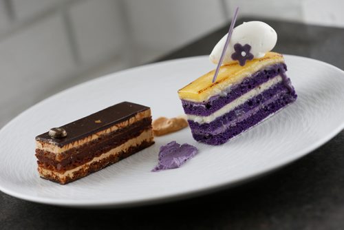JOHN WOODS / WINNIPEG FREE PRESS
Chef Sophon Chhin's creations "Café" (L) - Coffee joconde, coffee buttercream and ganache, chocolate glaze and "Ube" (R) - Ube joconde, ube buttercream, coconut ganache and cream, creme brûlée is on the menu at Baon's Manila Nights event, Midnight In Paris, the first in their new dessert pop-up series at Sugar Blooms and Cakes Cafe, Sunday, April 23, 2017.