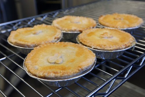 WAYNE GLOWACKI / WINNIPEG FREE PRESS

49.8 INTERSECTION. Pot Pies out of the oven.  Dustin Watson is the Lord of the Pies, he founded the biz in Sept 2016 . He is working in the United community kitchen to prepare his pies. Dave Sanderson story. April 24 2017