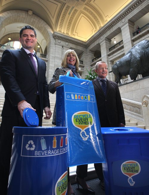 WAYNE GLOWACKI / WINNIPEG FREE PRESS

  Cathy Cox, Sustainable Development Minister holds up a new recycling bin bag for cottages and seasonal sites with at left Tom Thiessen, executive director, Building Owners and Managers Association of Manitoba  and Ken Friesen, executive director, Canadian Beverage Container Recycling Association in the Manitoba Legislative bld. Tuesday to announce new partnered recycling initiatives. The two other bins are used for commercial spaces. Nick Martin  story. April 25 2017