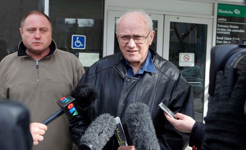 BORIS MINKEVICH / WINNIPEG FREE PRESS
Senior citizen James Aisaican-Chase has terminal cancer and is fighting a red light ticket. He appeared in court this morning. Wise up Winnipeg is using the case to advocate for longer amber lights. From left, Todd Dube from Wise up Winnipeg and James Aisaican-Chase talk to the press outside traffic court at 373 Broadway Avenue. JANE GERSTER STORY April 26, 2017