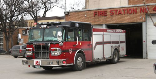 WAYNE GLOWACKI / WINNIPEG FREE PRESS

A fire truck departs the Fire Station #4 on Osborne St.   April 26 2017