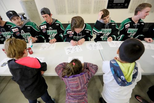TREVOR HAGAN / WINNIPEG FREE PRESS
Portage Terriers players, including Kurtis Chapman, middle, signing autographs for Elizabeth, 7, and Emma Beaulieu, 5, and Robert Maben, 7, at a rally at Stride Place in Portage la Prairie, Wednesday, April 26, 2017.