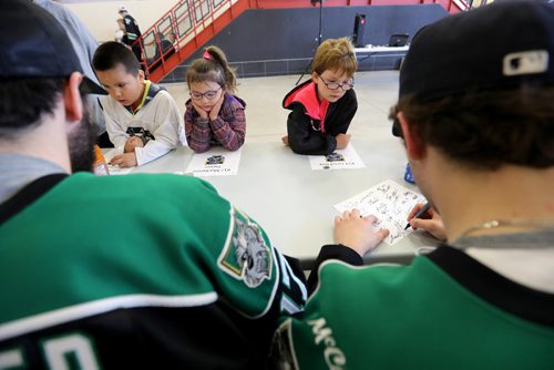 TREVOR HAGAN / WINNIPEG FREE PRESS
Portage Terriers players Mackenzie Dwyer, left, and Jared roy signing autographs for Robert Maben, 7, Emma Beaulieu, 5, and Elizabeth Beaulieu, 7, at a rally at Stride Place in Portage la Prairie, Wednesday, April 26, 2017.