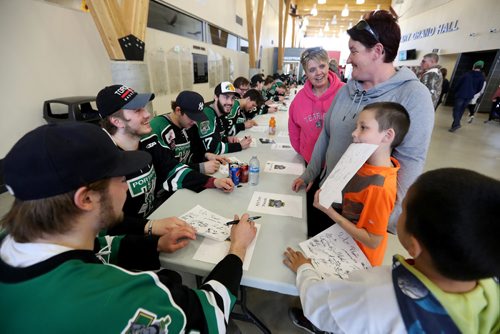 TREVOR HAGAN / WINNIPEG FREE PRESS
Portage Terriers, players and fans, from left, Darlene Maben, Robyn Godfrey, Joseph Beaulieu, 8 and Robert Maben, at a rally at Stride Place in Portage la Prairie, Wednesday, April 26, 2017.