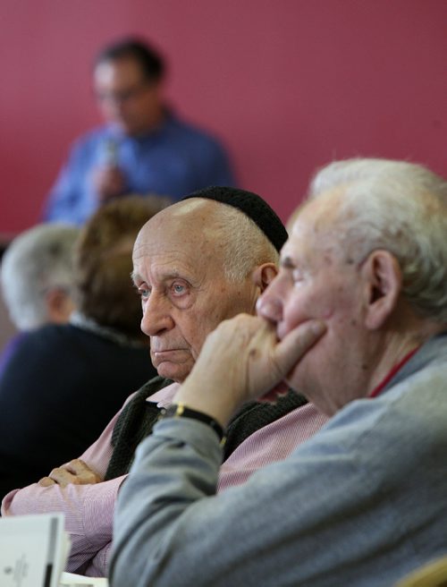 WAYNE GLOWACKI / WINNIPEG FREE PRESS

Holocaust survivors Ted Mueller, centre,  and Aron Lieberman at right listen to Rabbi Alan Green read a passage from HASIDIC TALES OF THE HOLOCAUST by Yaffa Eliach during the memorial service Thursday held at the Gwen Secter Creative Living Centre. Matt Olson story  April 27 2017