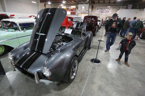 TREVOR HAGAN / WINNIPEG FREE PRESS
Lawrence Routly and his grandson, Vaughn Collet, 5, checking out a Shelby Cobra at a car show inside East End Arena, Saturday, April 29, 2017.
