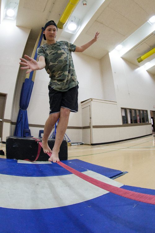 MIKE DEAL / WINNIPEG FREE PRESS
Parker Bohotchuk, 14, tries walking the tightrope during a gathering of the Winnipeg Circus Club at the Broadway Neighbourhood Centre. Anyone can join to learn how to juggle, hula hoop, ride a unicycle and walk a tightrope. 
170430 - Sunday, April 30, 2017.