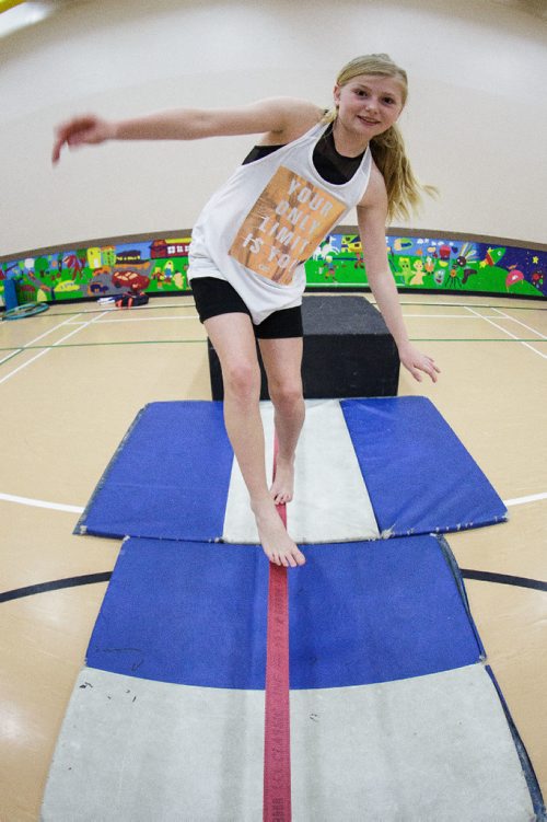 MIKE DEAL / WINNIPEG FREE PRESS
Callie Lane, 11, tries walking the tightrope during a gathering of the Winnipeg Circus Club at the Broadway Neighbourhood Centre. Anyone can join to learn how to juggle, hula hoop, ride a unicycle and walk a tightrope. 
170430 - Sunday, April 30, 2017.