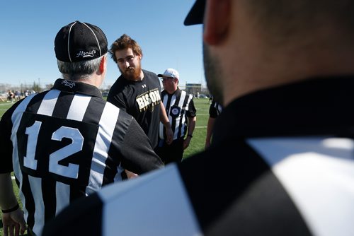 JOHN WOODS / WINNIPEG FREE PRESS
Officials line up to congratulate Geoff Grey who has signed with a NFL team and spoke to media and his former team at the University of Manitoba Bison's football season kickoff scrimmage at the University of Manitoba Sunday, April 30, 2017.