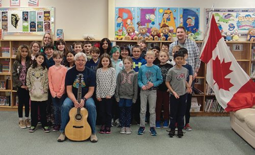 Canstar Community News Grade 4 students at Joseph Teres School (131 Sanford Fleming Rd.) wrote a song for Canada's 150th anniversary with local songwriter Aaron Burnett. The class debuted the song, "Celebrating Canada," at an assembly on April 28. (SHELDON BIRNIE/CANSTAR COMMUNITY NEWS/THE HERALD)
