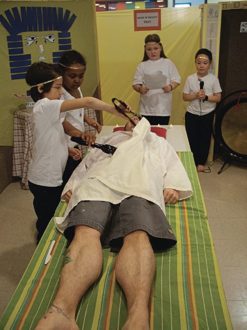 Canstar Community News April 25, 2017 - Students in Sandy Fazenda's Grade 2/3 class at Bernie Wolfe Community School (95 Bournais Dr.) prepared vice-principal Ryan Francis for "mummification" by "removing his organs." The group has been learning about ancient Egypt in social studies class. (SHELDON BIRNIE/CANSTAR/THE HERALD)