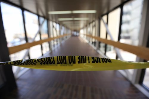 TREVOR HAGAN / WINNIPEG FREE PRESS
Police tape blocking the skywalk between the Millennium Library and the Police Headquarters following a shooting, Monday, May 1, 2017.