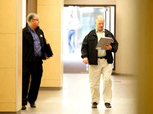 PHIL HOSSACK / WINNIPEG FREE PRESS  -  Internal Investigation Unit officers work their way along the city's skywalk thriough the Cargill Building Monday afternoon after a police shooting in the walkway over Garry street at Graham. See Mike McIntyre's story.  -  May1, 2017