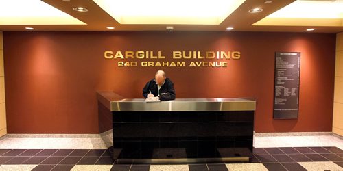 PHIL HOSSACK / WINNIPEG FREE PRESS  - An Internal Investigations Unit officer makes notes while checking security cameras and canvassing businesses along the walkway in the Cargill Building after a police shooting in the walkway over Garry street at Graham. See Mike MacIntyre's story.  -  May1, 2017