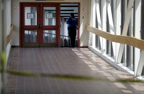 TREVOR HAGAN / WINNIPEG FREE PRESS
A cadet stands guard inside the skywalk between the Millennium Library and the Police headquarters building. Police are investigating after an officer shot a man in the skywalk, Monday, May 1, 2017.