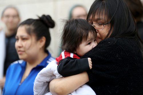 TREVOR HAGAN / WINNIPEG FREE PRESS
Widow of Errol Greene, Rochelle Pranteau-Greene, left, and his mother, Donna Greene holding 6 month old Errol Jr. at a vigil in his honour one year after he died in the Remand Centre, Monday, May 1, 2017.