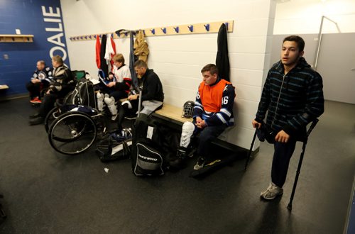 TREVOR HAGAN / WINNIPEG FREE PRESS
Team Manitoba sledge hockey practice featuring Omar Al Ziab, 15, right, a Syrian refugee and amputee who only took to the ice for the first time last August, Monday, May 1, 2017.
