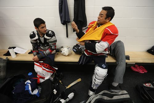 TREVOR HAGAN / WINNIPEG FREE PRESS
Omar Al Ziab, 15, and James Bernus prior to their Team Manitoba sledge hockey practice. Omar a Syrian refugee and amputee only took to the ice for the first time last August, Monday, May 1, 2017.
