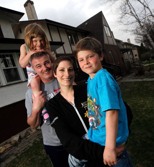 PHIL HOSSACK / WINNIPEG FREE PRESS  - Catherine Ledlow (Wreford) and her family, husband Joel Ledlow, son Elliot, 6, daughter Quinn, 3. Ledlow is a 36-year-old Winnipeg woman living with a brain tumour. She was diagnosed six weeks after her daughter was born. She's had surgery to remove as much of it as possible but must have MRIs every three months to check if it's growing or not. She is a very positive person who is telling her story to help raise money for cancer research, specifically brain cancer research, and will be running 5K  in this Sunday's WPS Half Marathon.  Ashley Prest story. -  May2, 2017